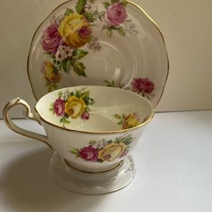Vintage Queen Anne Manor Roses tea cup and saucer. In excellent condition.